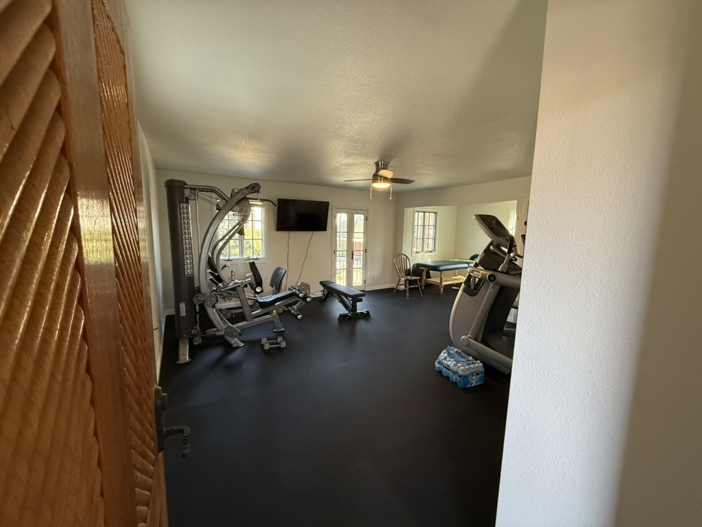 Home Gym & Flooring Renovation — Interior Remodel in DFW, TX — after photo, completed by Global Innovative Contractors